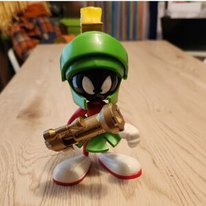 Green and Red Cartoon Character Figurine